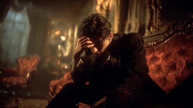 Grief-Stricken Man in Gothic Room